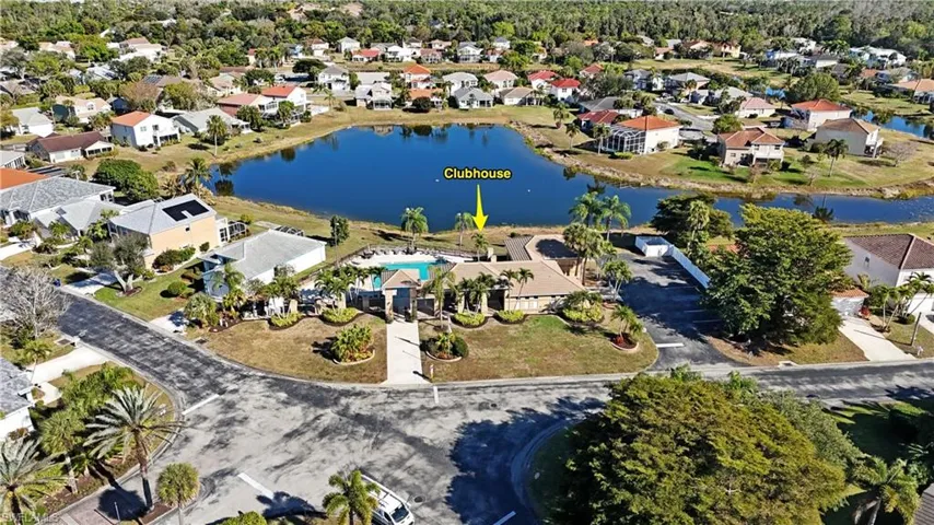 Aerial view of property's location featuring nearby suburban area and a large body of water