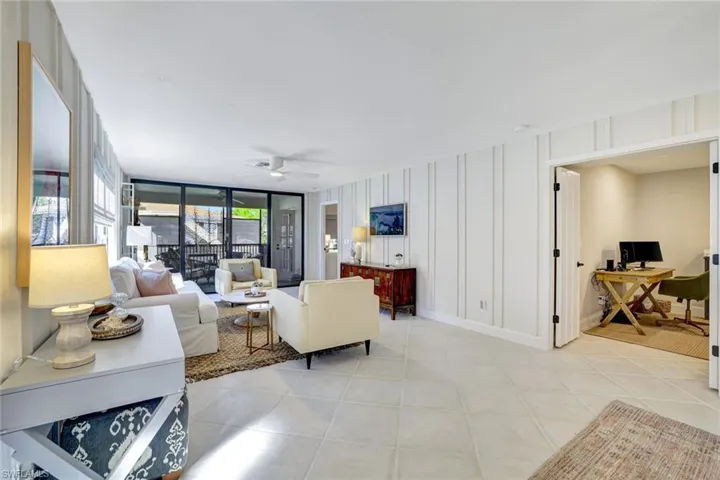 Beautiful Feature Wall Frames This Open Concept Open Concept Living and Dining Room!