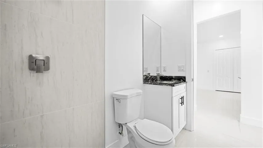 Bathroom with vanity and toilet