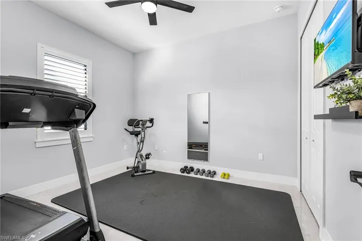 Exercise room featuring baseboards