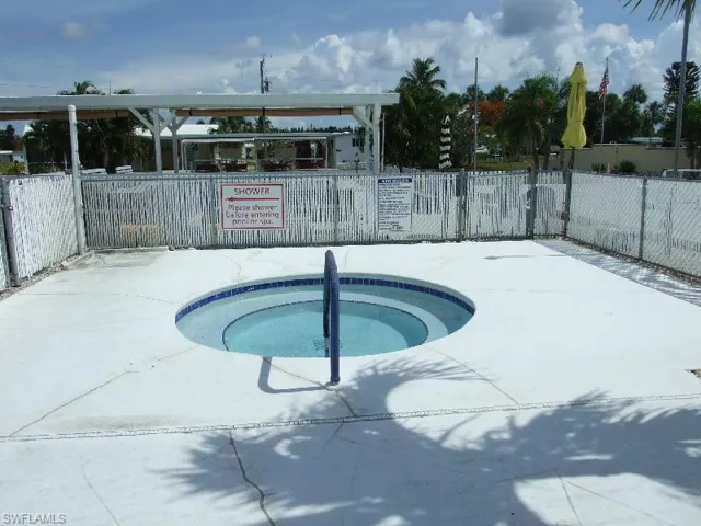 View of pool featuring a community hot tub