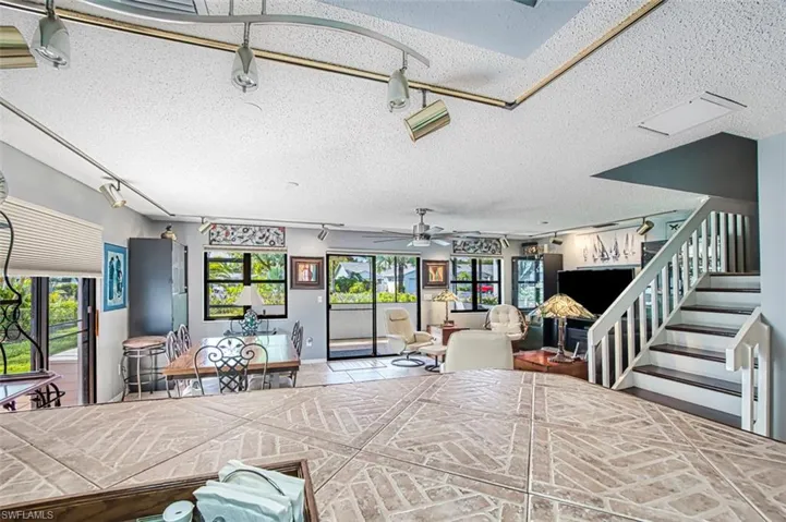 View from kitchen into the dining/living area.  Abundance of natural lighting.