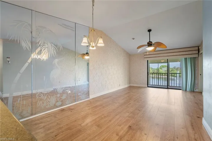 Family / dining area room featuring cathedral ceiling