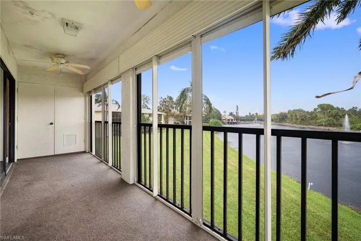 Unfurnished sunroom featuring ceiling fan