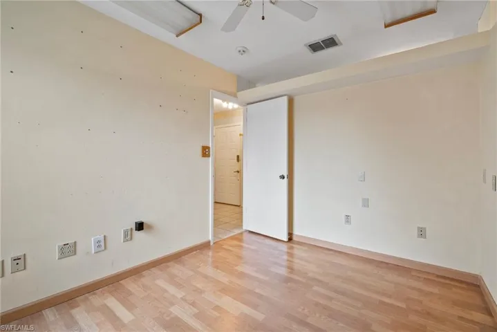 Spare room with light hardwood / wood-style floors and ceiling fan