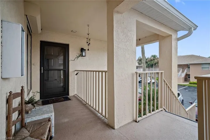 Property entrance featuring a balcony