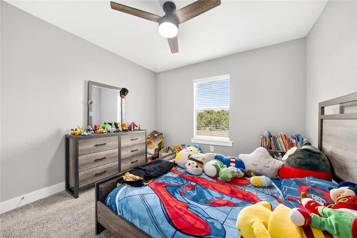 Bedroom with carpet and ceiling fan