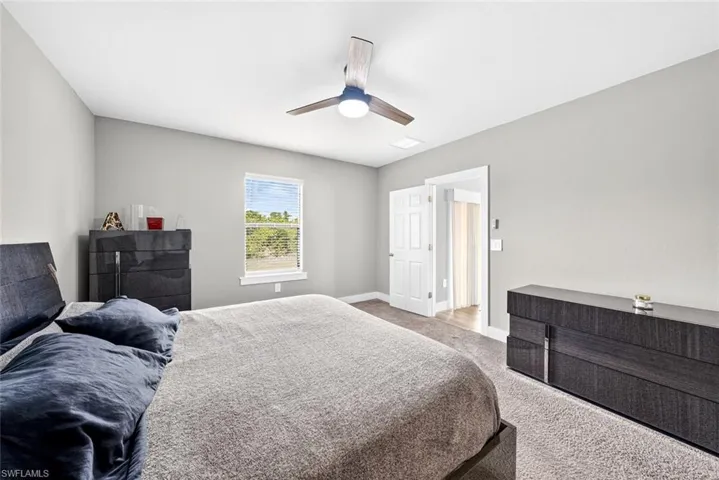 Bedroom with carpet floors and a ceiling fan