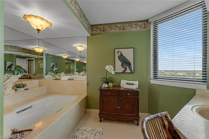 Primary Bath with a soaking tub, tile flooring, and newer walk in shower(not shown)