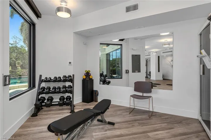 Workout area with free weights and infared sauna