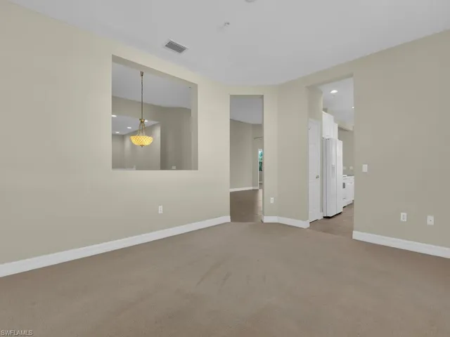 Home office/gym/den located off of main living area and kitchen