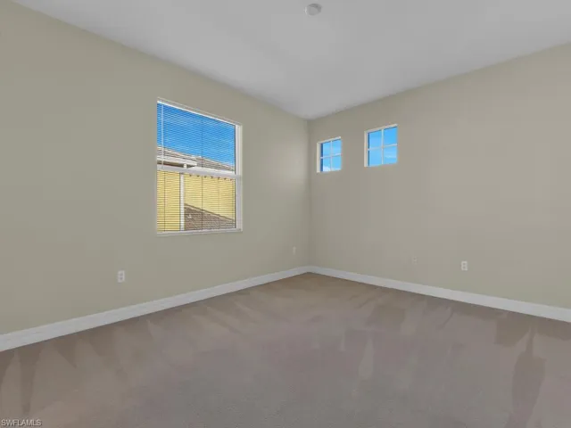 Home office/gym/den located off of main living area and kitchen