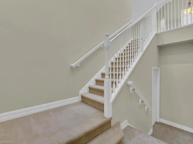 Stairway to main living area from front entry