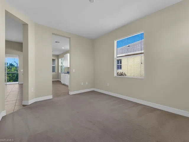 Home office/gym/den located off of main living area and kitchen