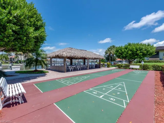 View of property's community featuring a gazebo and shuffleboard
