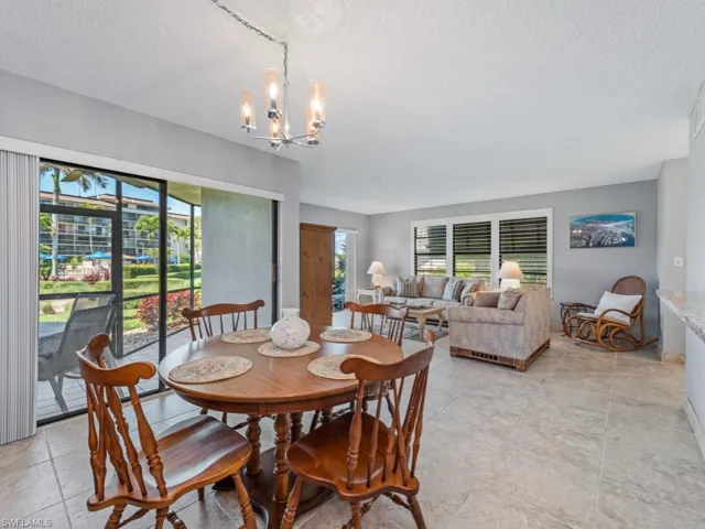Dining space featuring plenty of natural light and a textured ceiling