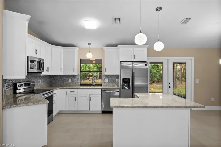 Updated kitchen with Island & Breakfast Bar.