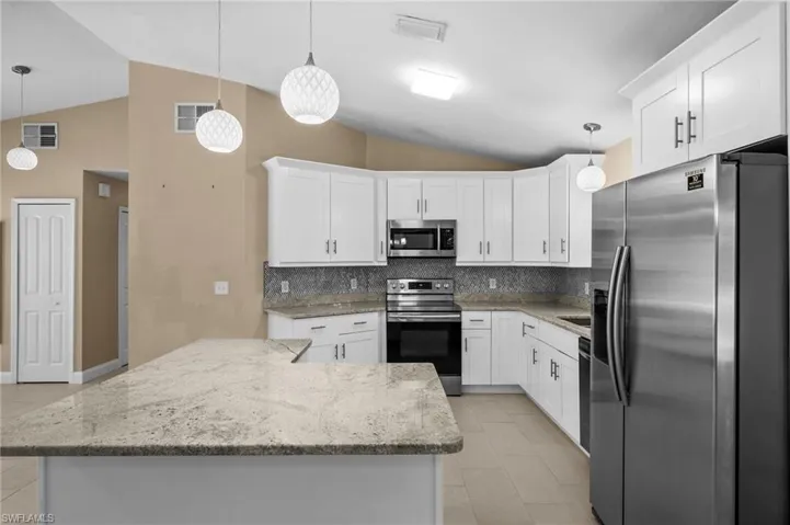 Updated kitchen with Island & Breakfast Bar.