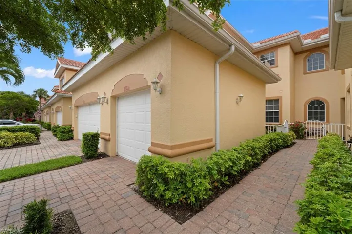 View of side of property with a garage