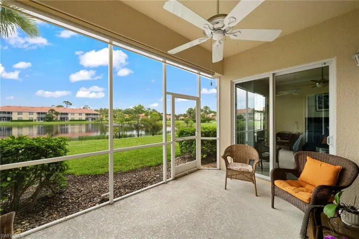 Sunroom with a water view and ceiling fan