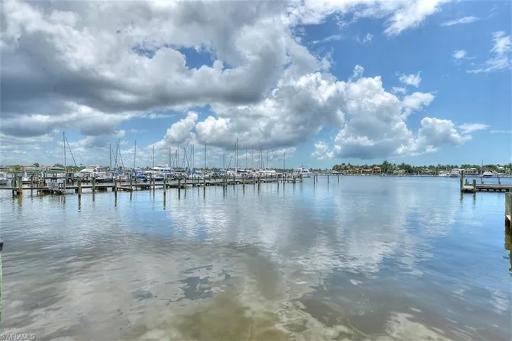 Property view of water featuring a boat dock