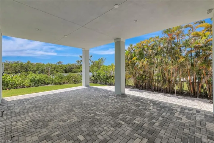 View of patio with fence