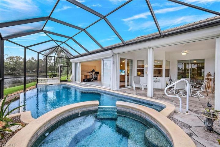 Lanai and pool area with an abundance of covered space for dining and lounging.