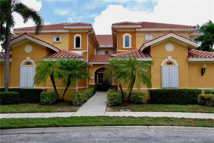 Mediterranean / spanish house featuring stucco siding and a tiled roof