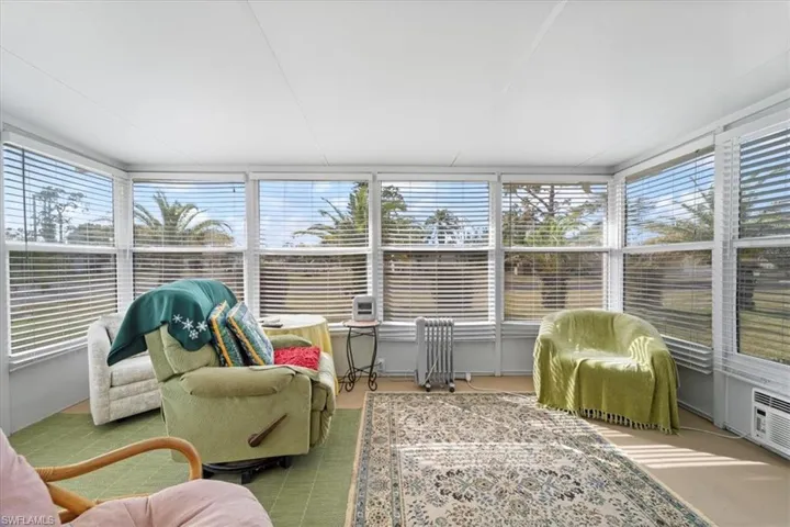 Sunroom featuring a healthy amount of sunlight