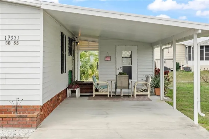 View of patio / terrace featuring a carport