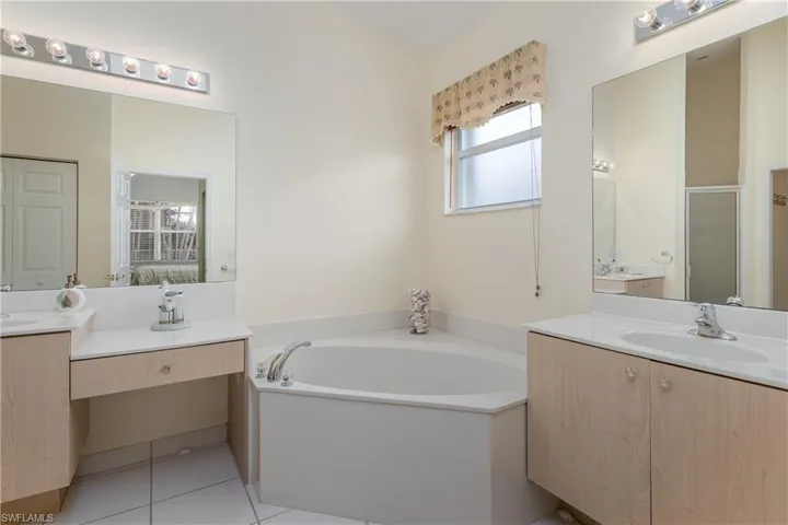 Corner soaking tub, dual vanity sinks,