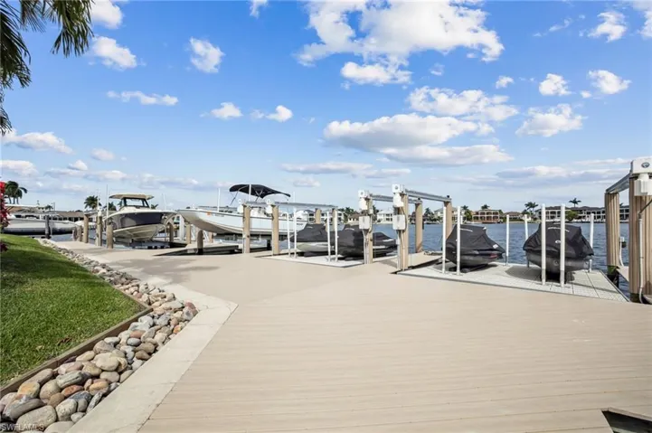 Dock with a water view and boat lift