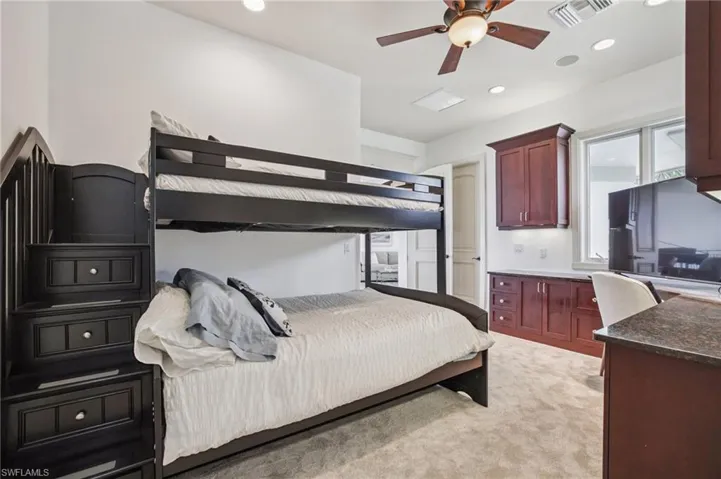 Bedroom featuring light carpet, recessed lighting, and a ceiling fan
