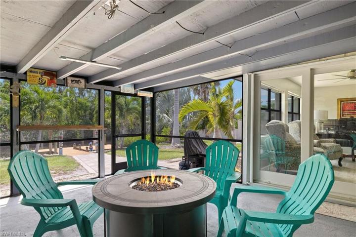 Screened Lanai, outdoor beverage fridge and storage area
