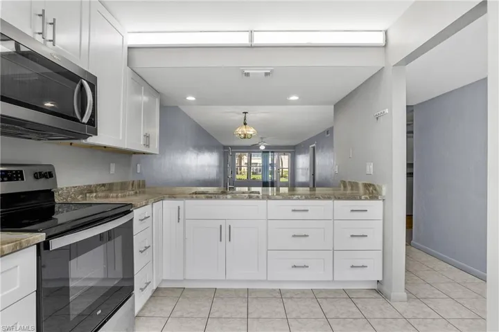 The kitchen is open to the Great Room and open to Sunlight!