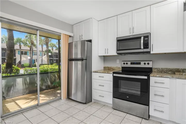 Sliding Glass Doors lead to lanai off of kitchen
