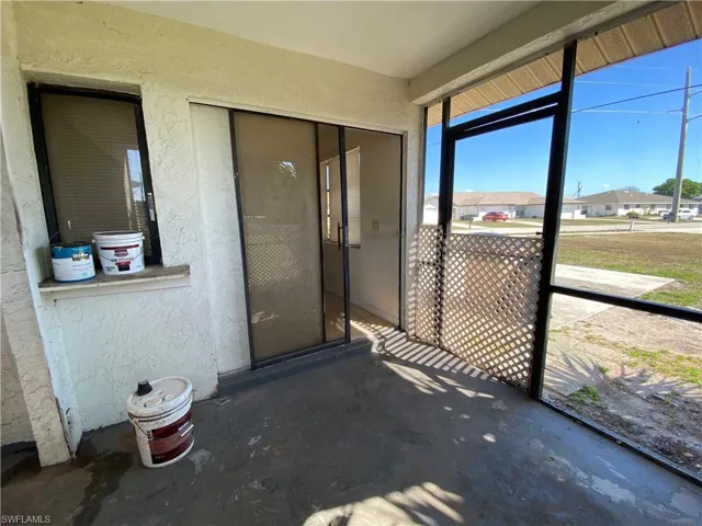 Unfurnished sunroom featuring a residential view