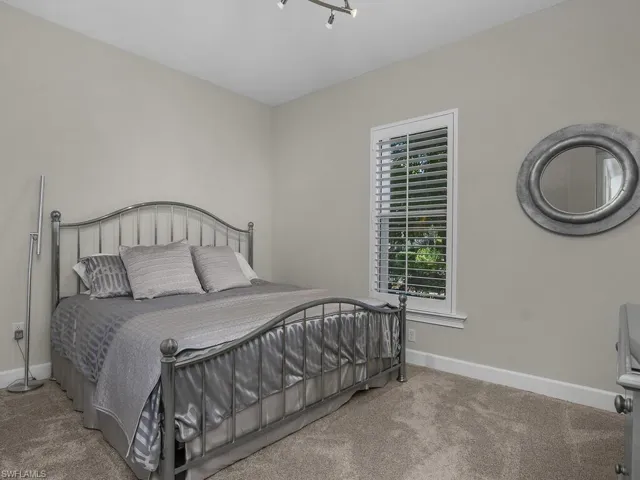Guest Bedroom featuring Plantation Shutters, very neat and clean!