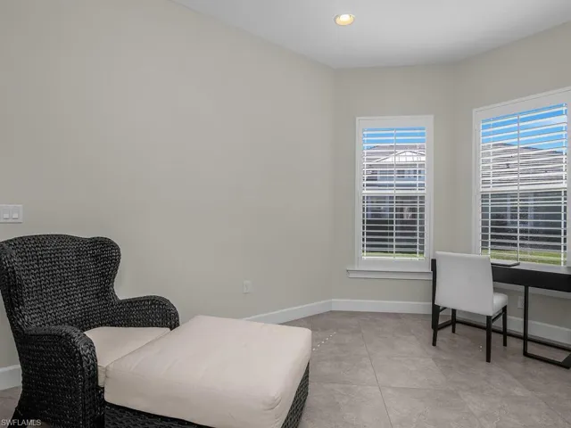 Office featuring recessed lighting and light tile patterned floors, Plantation Shutters cover the Bay Windows.