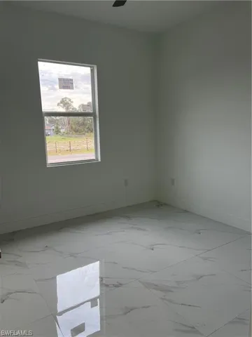 Empty room with tile patterned flooring