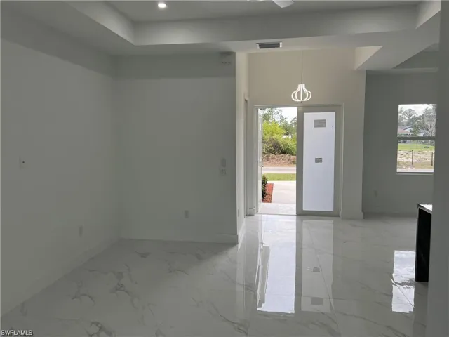 Spare room with light tile patterned floors