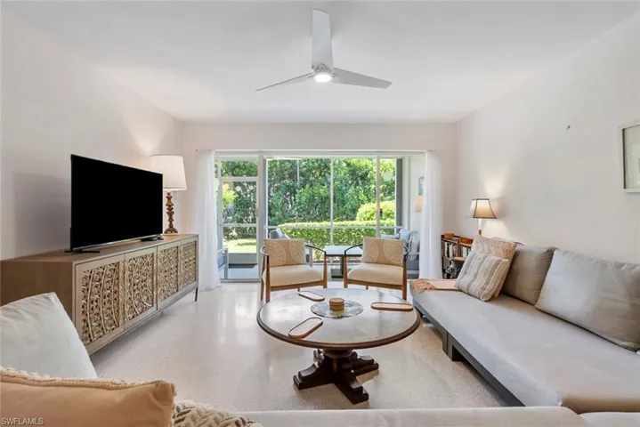 Living room featuring ceiling fan