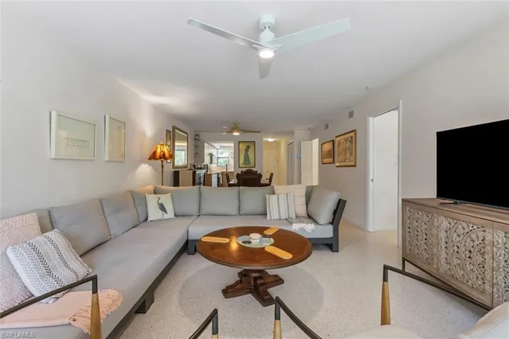 Living room featuring ceiling fan