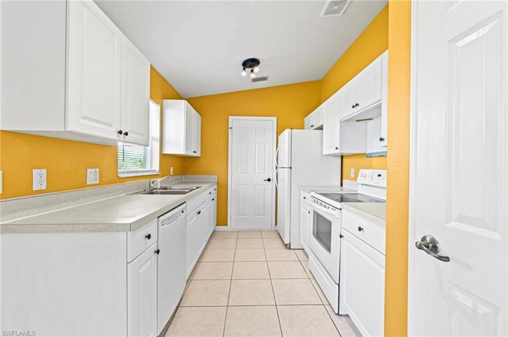 Kitchen with service to garage and pantry