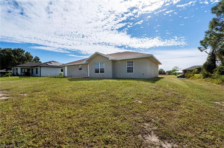 wide angle of the back yard and back of house