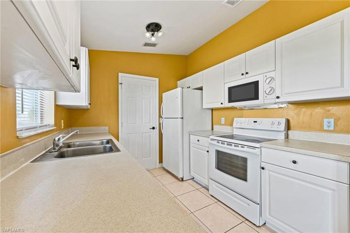 Galley Kitchen, clean and open.