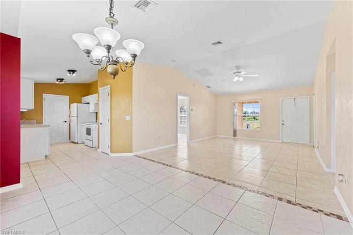 wide angle from dining room to show dining, kitchen and livingroom