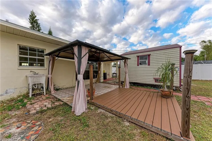 Deck with a gazebo and a patio