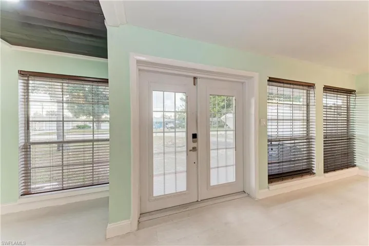 Entryway with french doors and baseboards