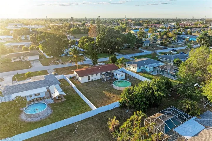 Aerial view of residential area with a pool